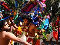 Dancers wearing peacock feathers perform during Ganesh Chaturthi, the annual Hindu celebration, in the streets of Paris, France, in Paris, F...