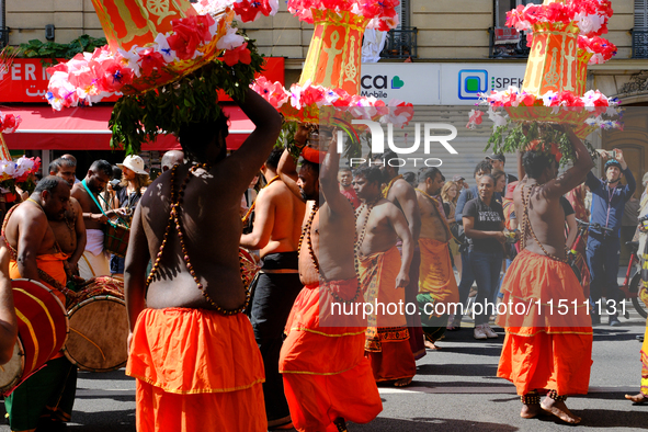 Hindus dance during Ganesh Chaturthi in the streets of Paris, France, in Paris, France, on August 25, 2024.  