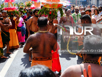 Hindu flagellants take part in the Ganesh Chaturthi procession, in Paris, France, on August 25, 2024.  (