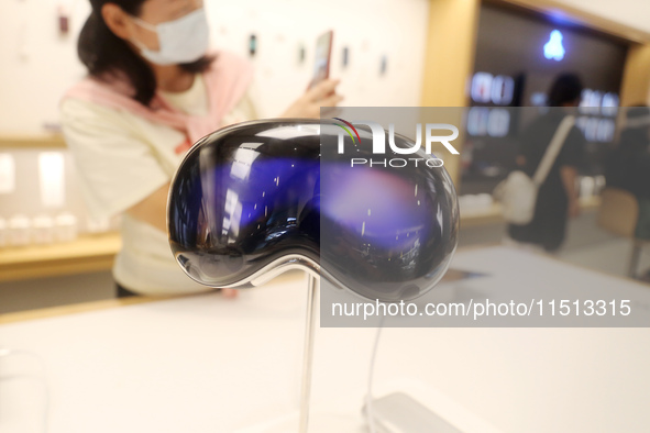 Students experience the Apple Vision Pro inside the flagship Apple store in Shanghai, China, on August 22, 2024. 