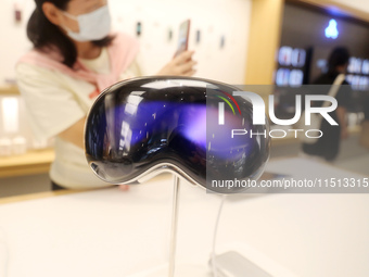 Students experience the Apple Vision Pro inside the flagship Apple store in Shanghai, China, on August 22, 2024. (