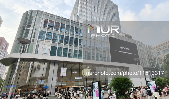 Students experience Apple products at the Apple flagship store in Shanghai, China, on August 22, 2024. 