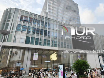 Students experience Apple products at the Apple flagship store in Shanghai, China, on August 22, 2024. (