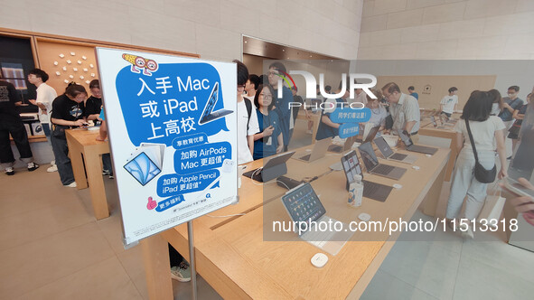 Students experience Apple products at the Apple flagship store in Shanghai, China, on August 22, 2024. 