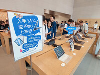 Students experience Apple products at the Apple flagship store in Shanghai, China, on August 22, 2024. (