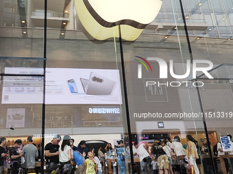 Students experience Apple products at the Apple flagship store in Shanghai, China, on August 22, 2024. (