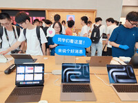 Students experience Apple products at the Apple flagship store in Shanghai, China, on August 22, 2024. (