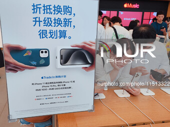 Students experience Apple products at the Apple flagship store in Shanghai, China, on August 22, 2024. (