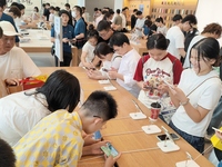 Students experience Apple products at the Apple flagship store in Shanghai, China, on August 22, 2024. (