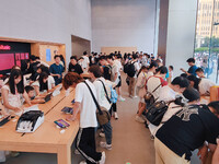 Students experience Apple products at the Apple flagship store in Shanghai, China, on August 22, 2024. (