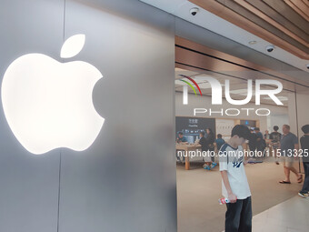 Students experience Apple products at the Apple flagship store in Shanghai, China, on August 22, 2024. (