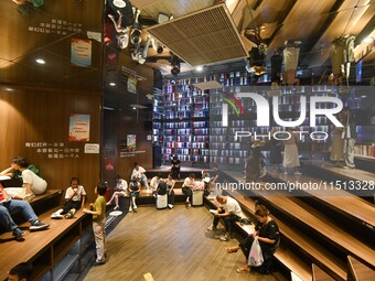 People read at Zhongshuge Bookstore in Guiyang, China, on August 18, 2024. (