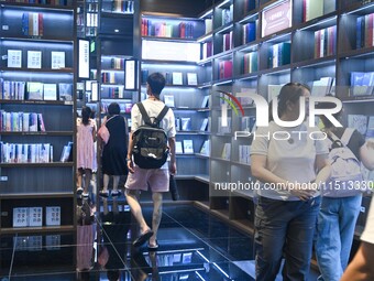 People read at Zhongshuge Bookstore in Guiyang, China, on August 18, 2024. (