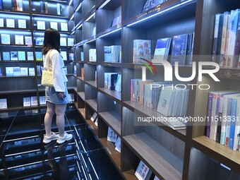 People read at Zhongshuge Bookstore in Guiyang, China, on August 18, 2024. (