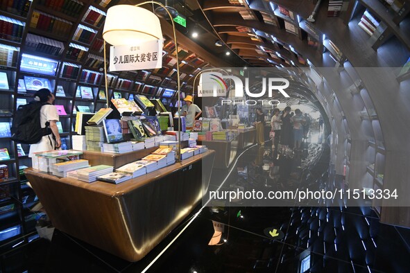 People read at Zhongshuge Bookstore in Guiyang, China, on August 18, 2024. 