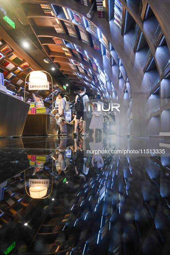 People read at Zhongshuge Bookstore in Guiyang, China, on August 18, 2024. 