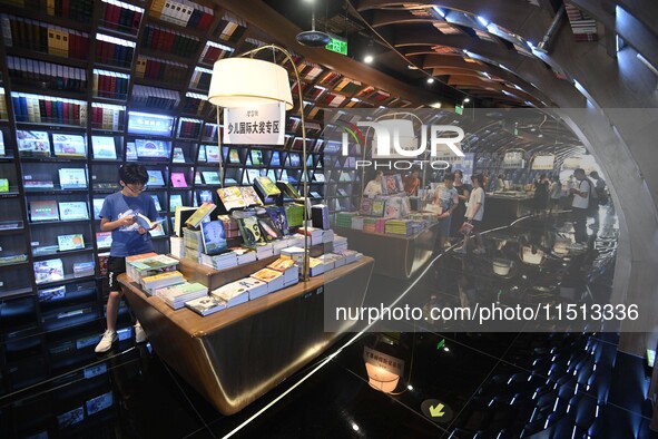 People read at Zhongshuge Bookstore in Guiyang, China, on August 18, 2024. 