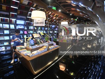 People read at Zhongshuge Bookstore in Guiyang, China, on August 18, 2024. (