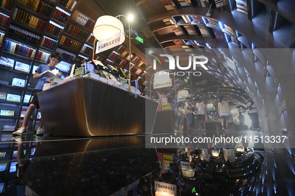 People read at Zhongshuge Bookstore in Guiyang, China, on August 18, 2024. 