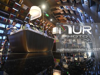 People read at Zhongshuge Bookstore in Guiyang, China, on August 18, 2024. (