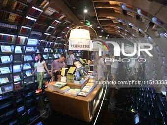 People read at Zhongshuge Bookstore in Guiyang, China, on August 18, 2024. (