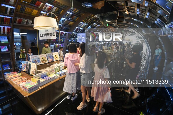 People read at Zhongshuge Bookstore in Guiyang, China, on August 18, 2024. 