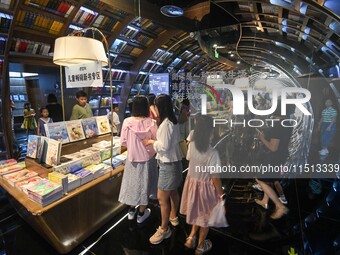 People read at Zhongshuge Bookstore in Guiyang, China, on August 18, 2024. (