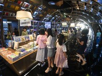 People read at Zhongshuge Bookstore in Guiyang, China, on August 18, 2024. (