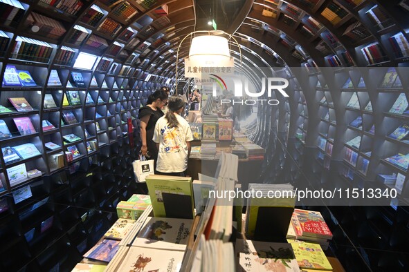 People read at Zhongshuge Bookstore in Guiyang, China, on August 18, 2024. 