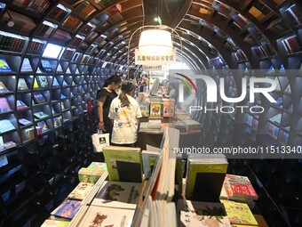 People read at Zhongshuge Bookstore in Guiyang, China, on August 18, 2024. (