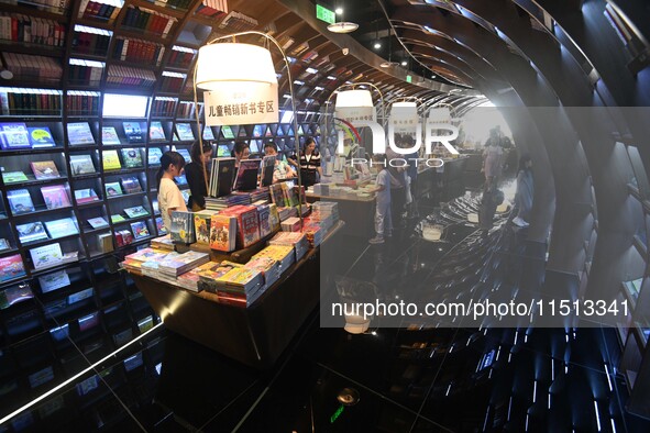 People read at Zhongshuge Bookstore in Guiyang, China, on August 18, 2024. 