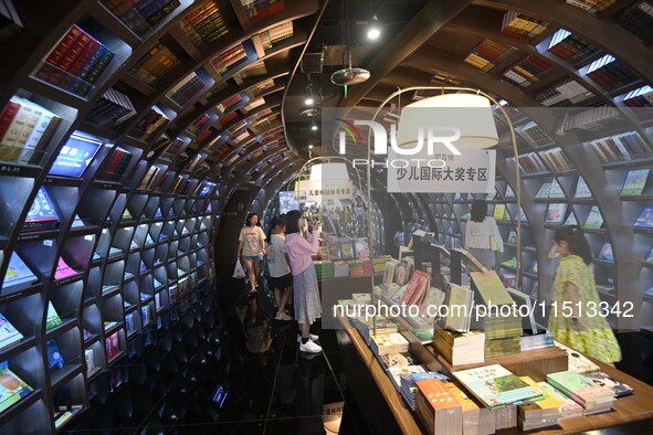 People read at Zhongshuge Bookstore in Guiyang, China, on August 18, 2024. 