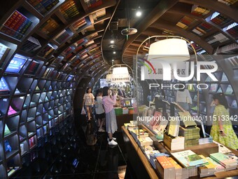 People read at Zhongshuge Bookstore in Guiyang, China, on August 18, 2024. (