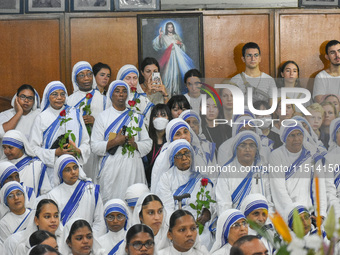 People and sisters of Missionaries of Charity participate in prayer on the occasion of the birthday of Saint Teresa at Mother House in Kolka...