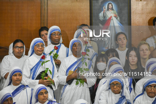 People and sisters of Missionaries of Charity participate in prayer on the occasion of the birthday of Saint Teresa at Mother House in Kolka...