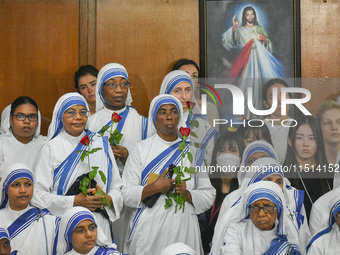 People and sisters of Missionaries of Charity participate in prayer on the occasion of the birthday of Saint Teresa at Mother House in Kolka...