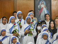 People and sisters of Missionaries of Charity participate in prayer on the occasion of the birthday of Saint Teresa at Mother House in Kolka...