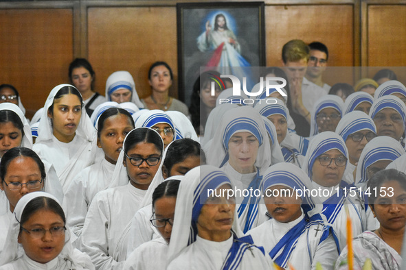 People and sisters of Missionaries of Charity participate in prayer on the occasion of the birthday of Saint Teresa at Mother House in Kolka...