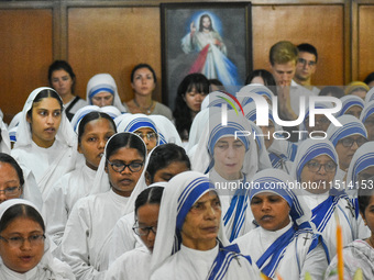 People and sisters of Missionaries of Charity participate in prayer on the occasion of the birthday of Saint Teresa at Mother House in Kolka...