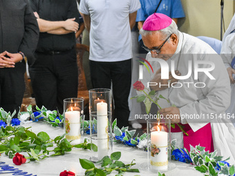 The archbishop of Kolkata prays in front of Saint Teresa's tomb on the occasion of Saint Teresa's birthday at Mother House in Kolkata, India...