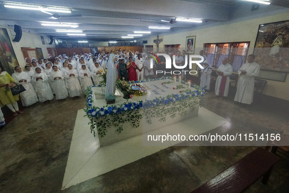 People and sisters of Missionaries of Charity participate in prayer on the occasion of the birthday of Saint Teresa at Mother House in Kolka...