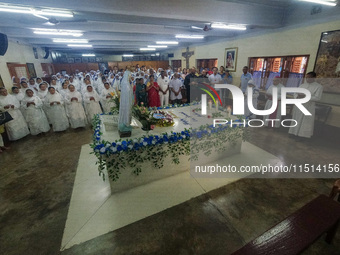 People and sisters of Missionaries of Charity participate in prayer on the occasion of the birthday of Saint Teresa at Mother House in Kolka...