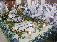 Sisters of Missionaries of Charity pray in front of Saint Teresa's tomb on the occasion of Saint Teresa's birthday at Mother House in Kolkat...