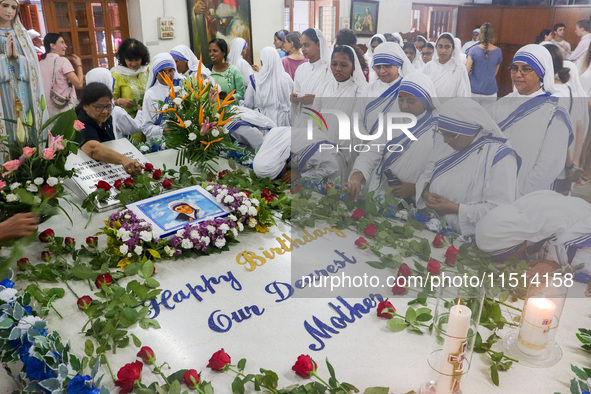 People and sisters of Missionaries of Charity participate in prayer on the occasion of the birthday of Saint Teresa at Mother House in Kolka...