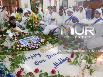 People and sisters of Missionaries of Charity participate in prayer on the occasion of the birthday of Saint Teresa at Mother House in Kolka...