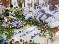 People and sisters of Missionaries of Charity participate in prayer on the occasion of the birthday of Saint Teresa at Mother House in Kolka...