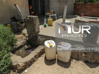 Plastic jerry cans filled with drinking water in a house in a rural area in Kairouan, Tunisia, on May 6, 2024. As the region faces water str...