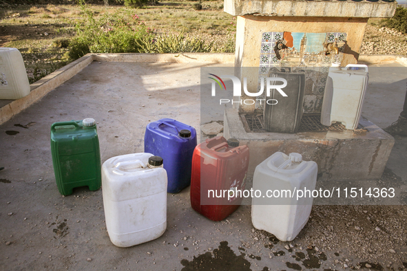 Plastic cans filled with water at a drinking water point in the isolated rural area of Chrichira located in Kairouan, Tunisia, on May 8, 202...