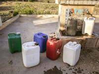 Plastic cans filled with water at a drinking water point in the isolated rural area of Chrichira located in Kairouan, Tunisia, on May 8, 202...