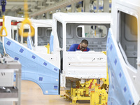 A worker works on an automobile production line at BYD Industrial Co LTD in Huai'an, China, on August 26, 2024. (